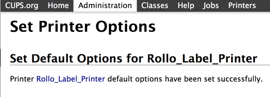 La pantalla de éxito de Establecer opciones de impresora dice: "Las opciones predeterminadas de la impresora Rollo_Label_Printer se han configurado correctamente".